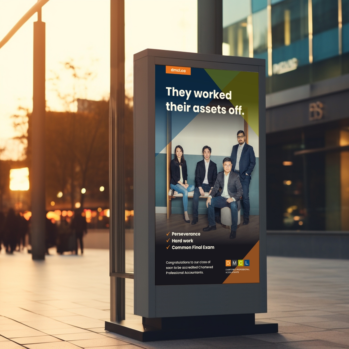 An outdoor advertising display in an urban street showcasing a DMCL Chartered Professional Accountants poster.