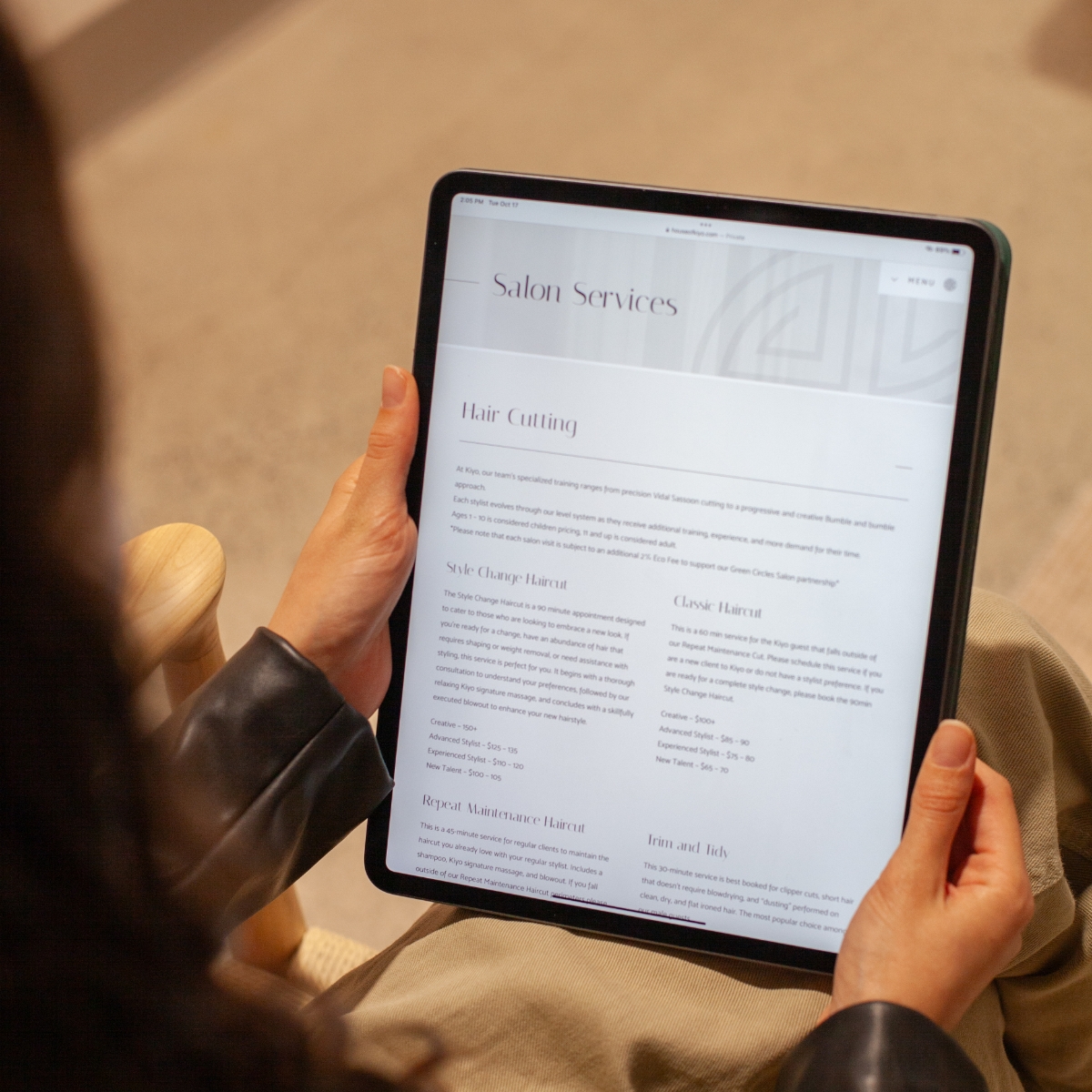 Responsive website design on a tablet for House of Kiyo with clean, modern visuals, showing salon services. Website designed and developed by Array.