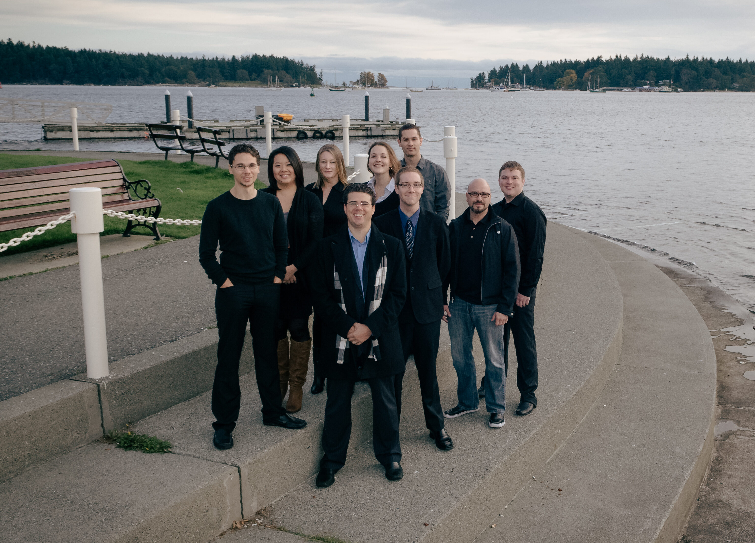 9 members of Array's team of web developers, designers, and marketers in 2009 smiling for a team photo in Nanaimo.