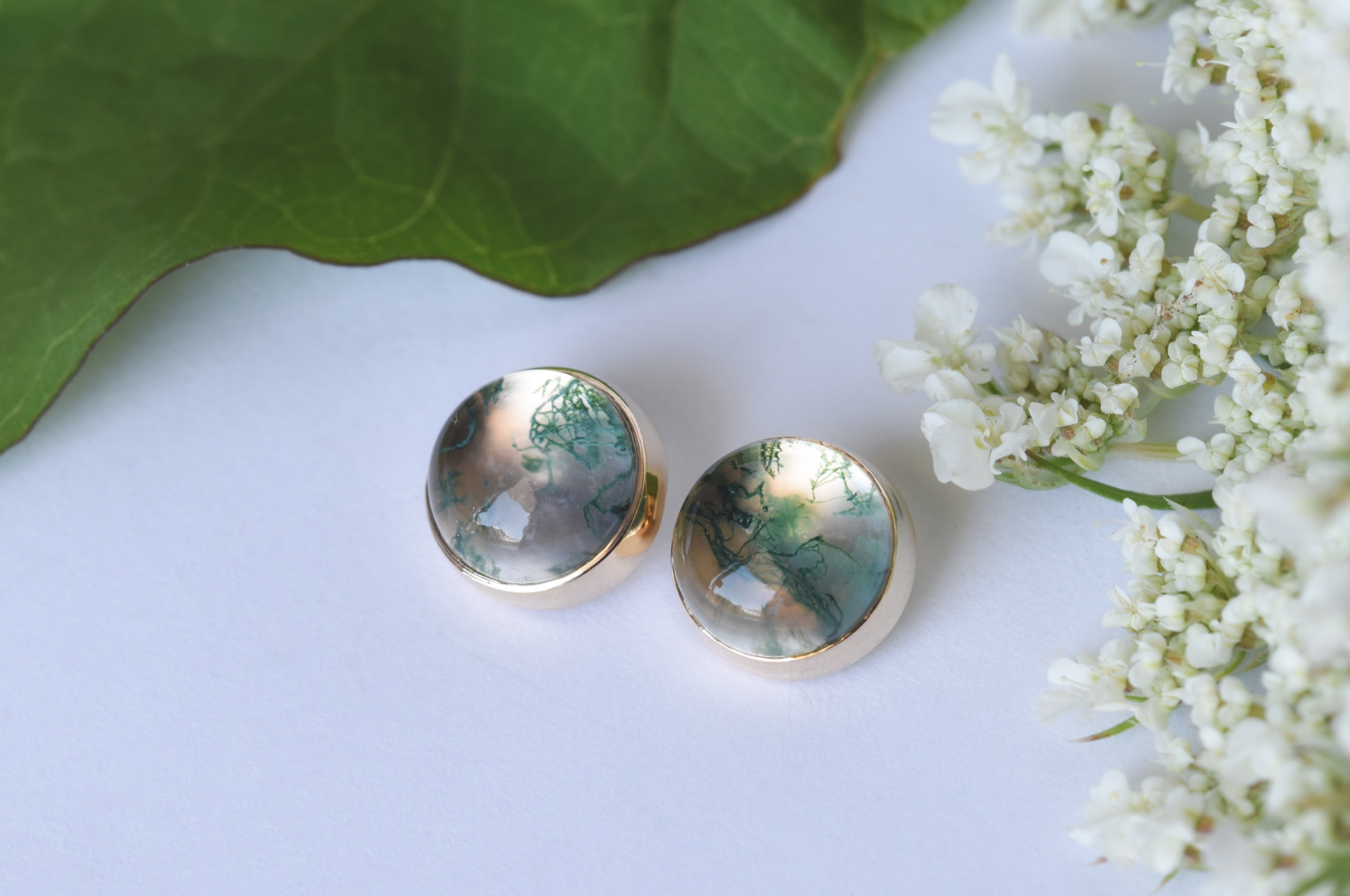 Gold and marbled glass spherical earrings.