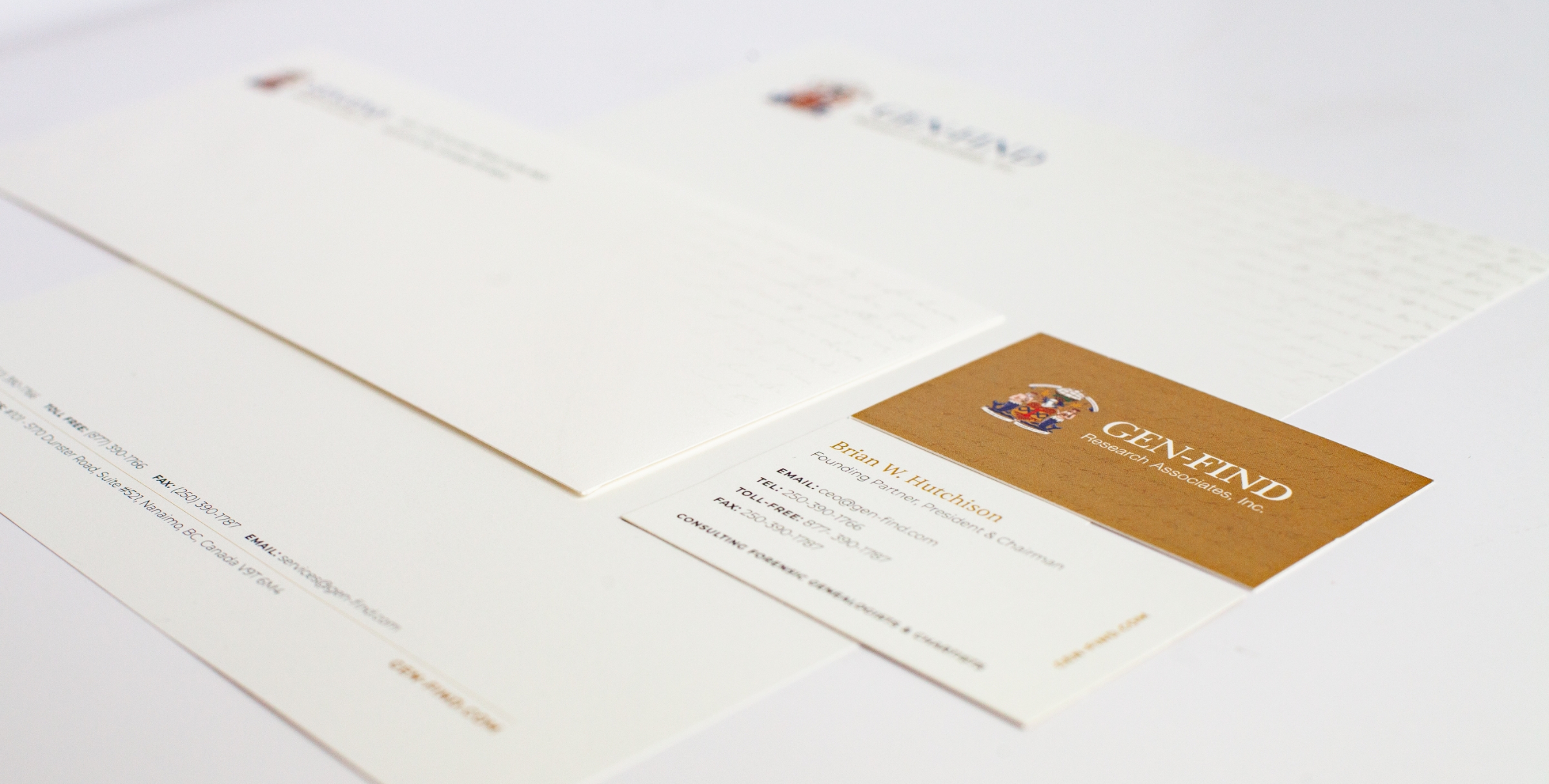 Stationary and business cards with GEN-FIND's branding.