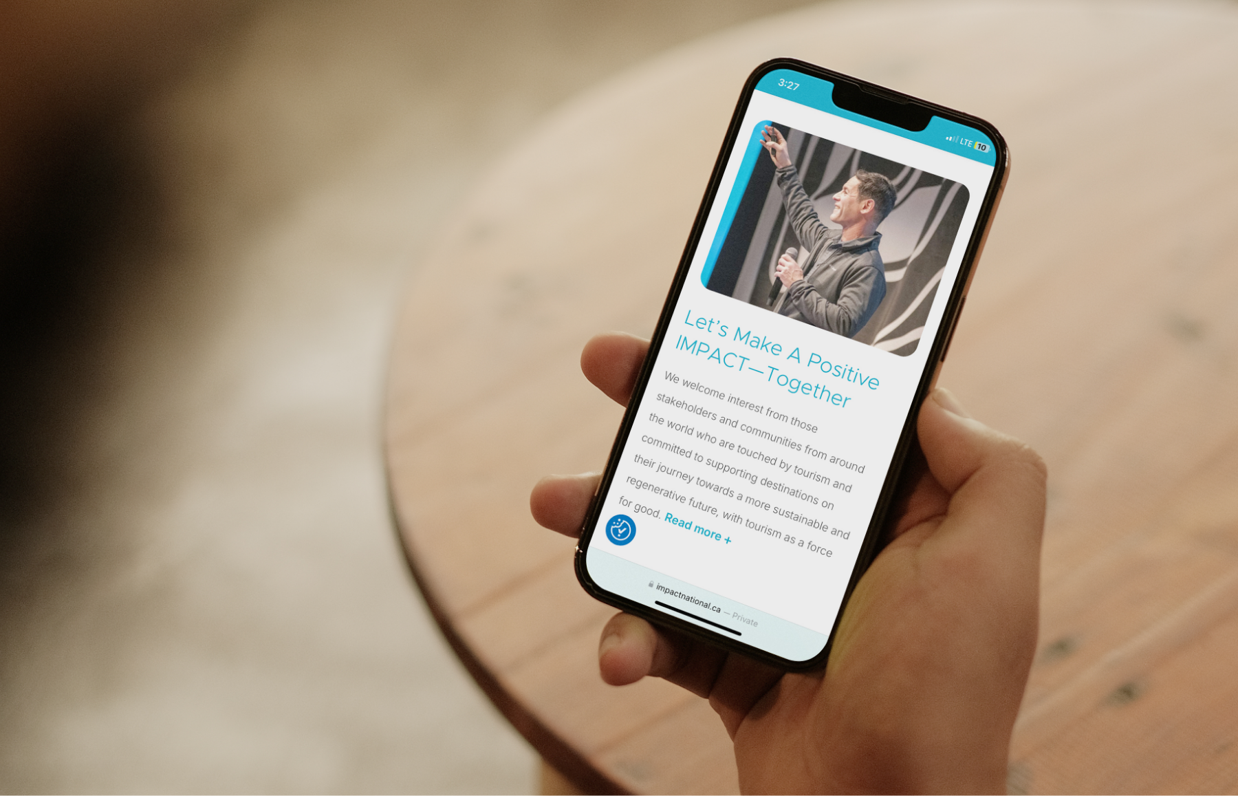 Mobile phone displaying the IMPACT website, designed and developed by Array.