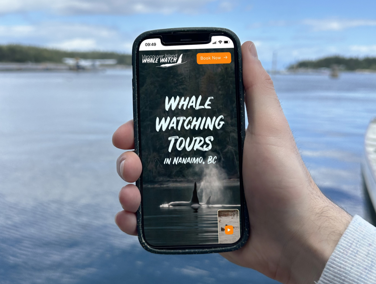Phone displaying Vancouver Island Whale Watch page.